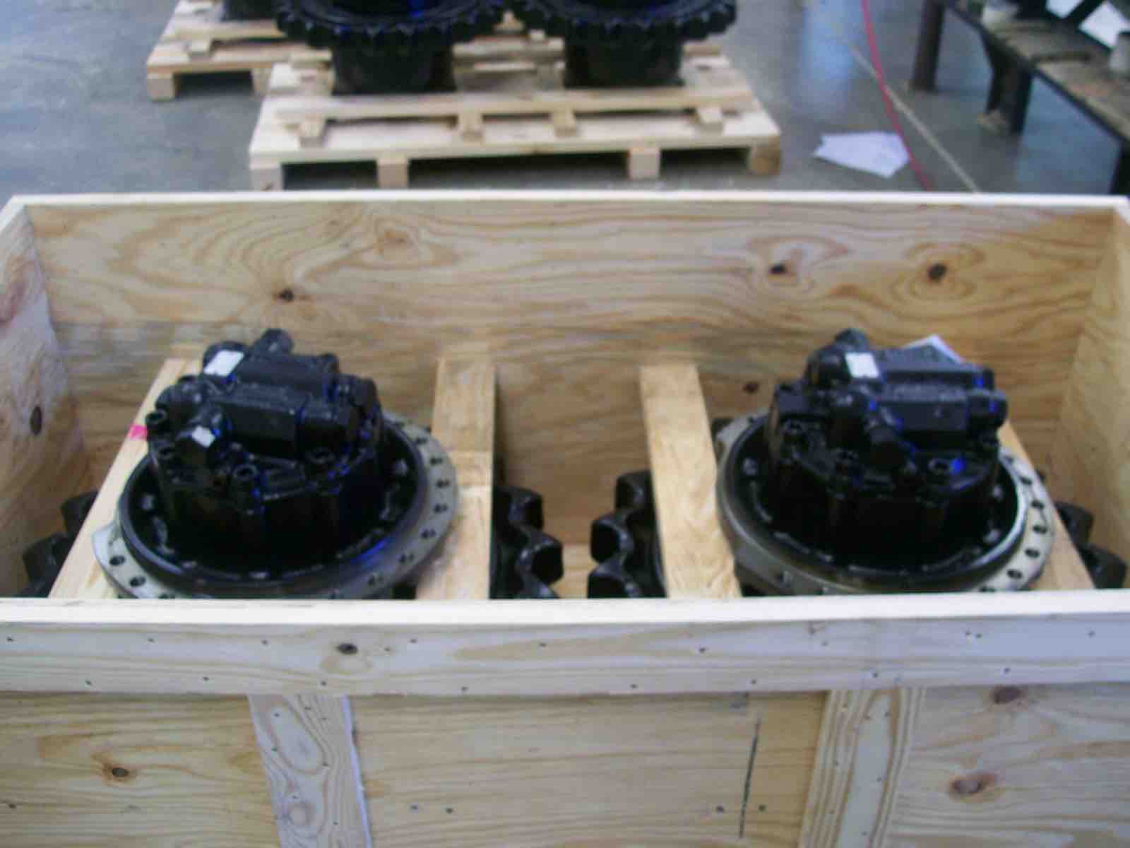 Two gear assemblies packed in a wooden crate with custom dividers